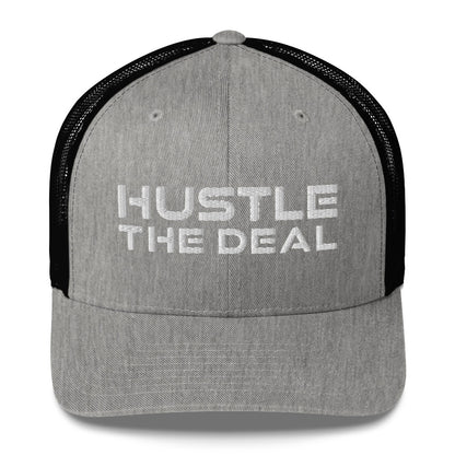 Heather gray and black trucker hat with embroidered Hustle The Deal logo